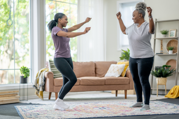 women dancing in living room