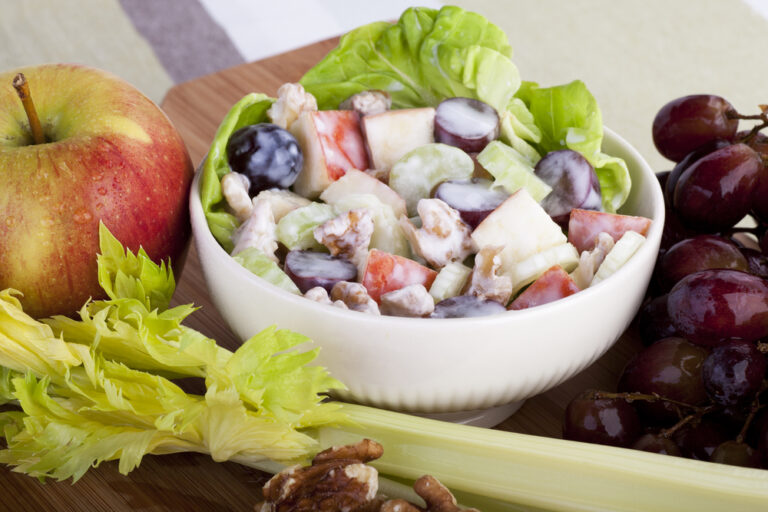 Bowl,Of,Waldorf,Salad,Surrounded,By,Ingredients,For,Salad.